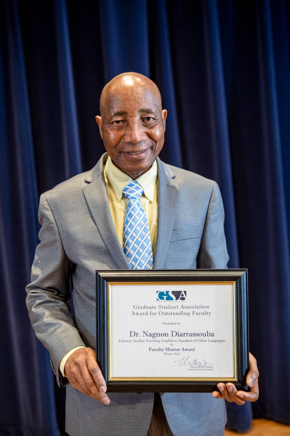 Dr. Nagnon Diarrassouba holding his certificate